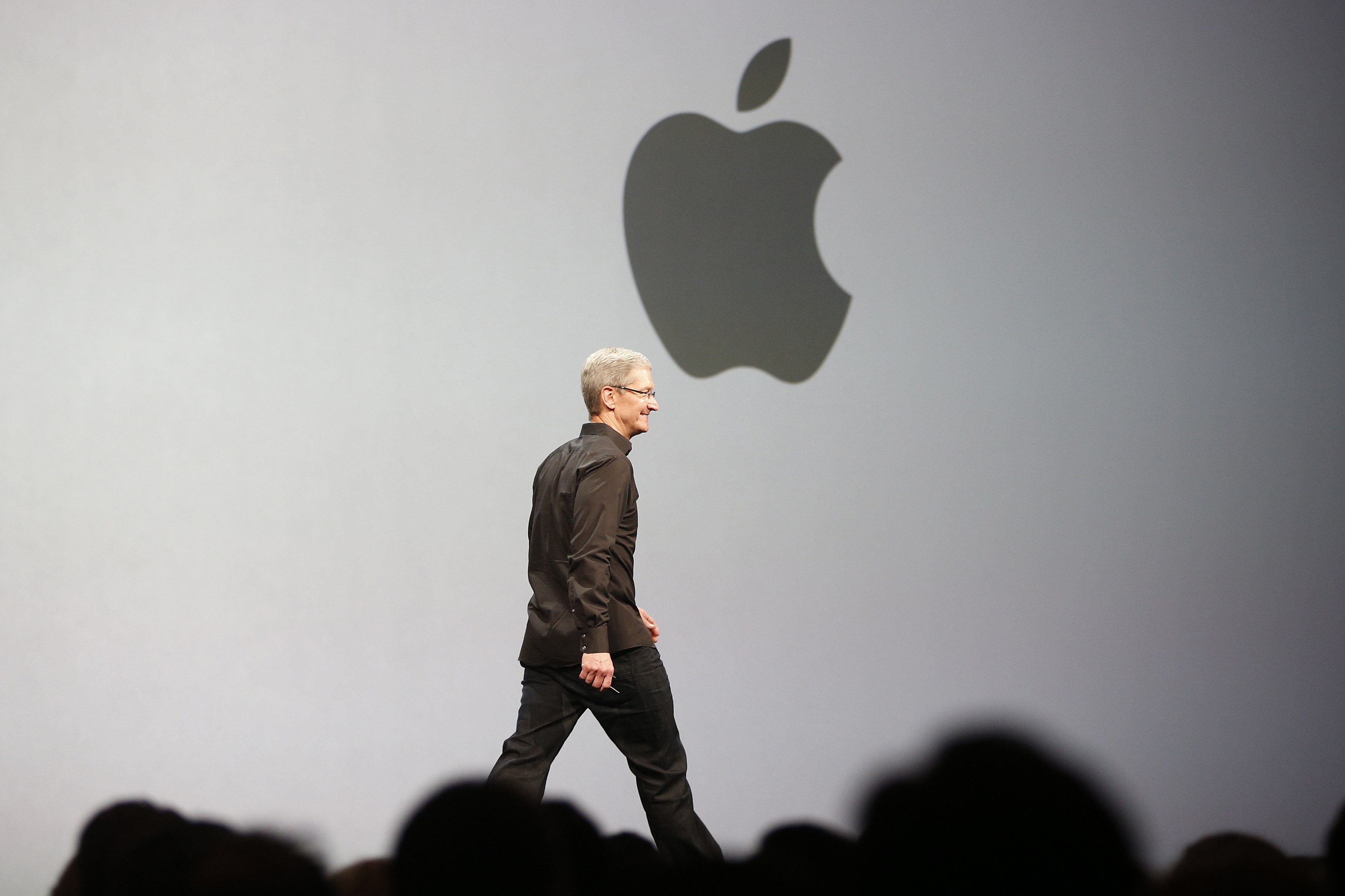 Apple CEO Cook takes stage during WWDC 2013 in San Francisco