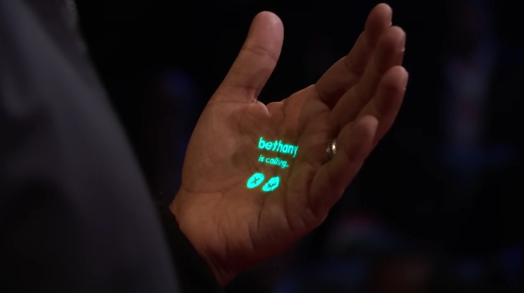 lo smartphone che si proietta sulla mano si chiama ai pin